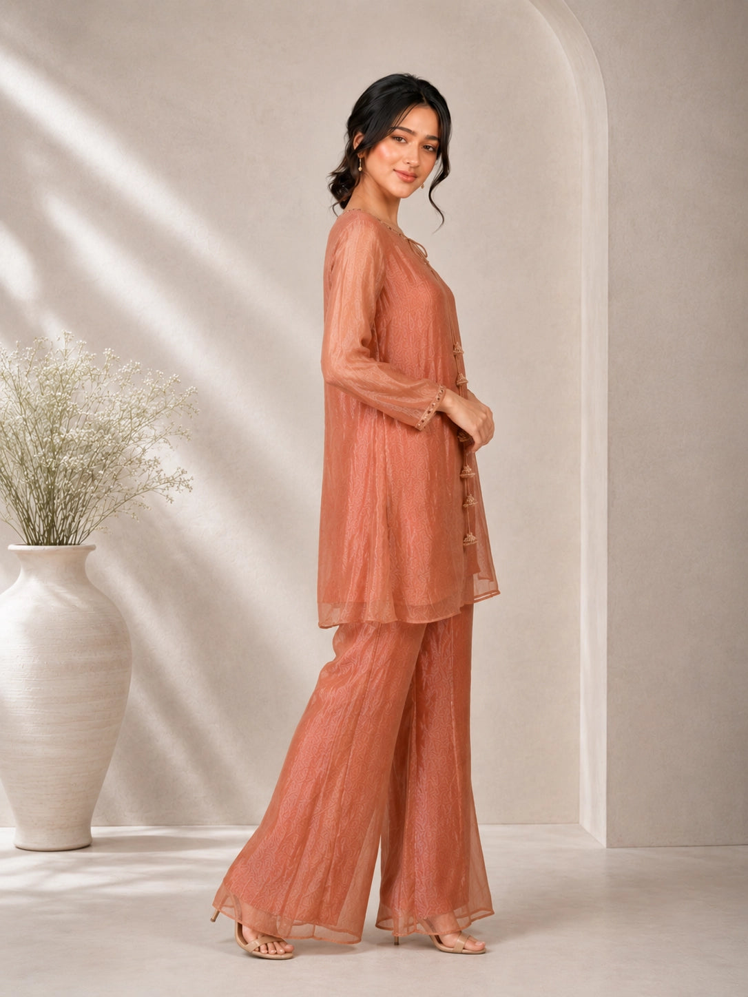 Elegant Peach Embroidered Kurta with Tassel Detail