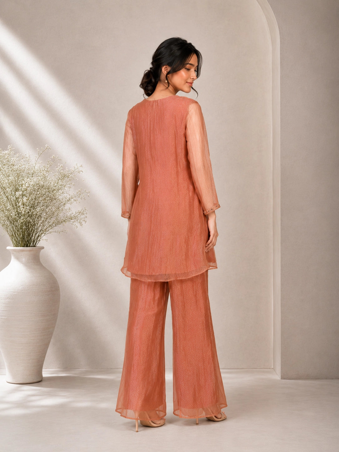 Elegant Peach Embroidered Kurta with Tassel Detail