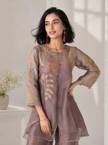 Woman wearing a brown embroidered Sharara with leaf motifs and a bird detail, perfect for festive occasions.