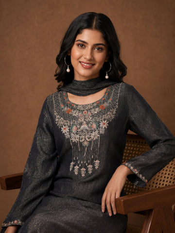 Woman wearing a Fawn sparkling embroidered Sharara with intricate floral details on the neckline and cuffs.