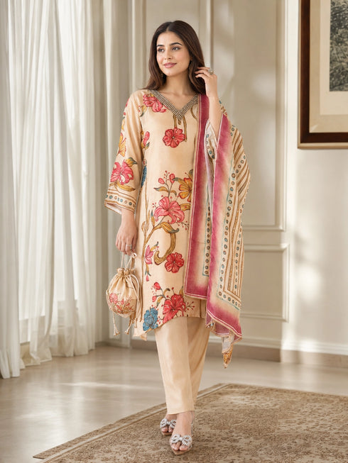 Woman wearing a brown floral print kurta set with a dupatta, embellished neckline, and matching pants.