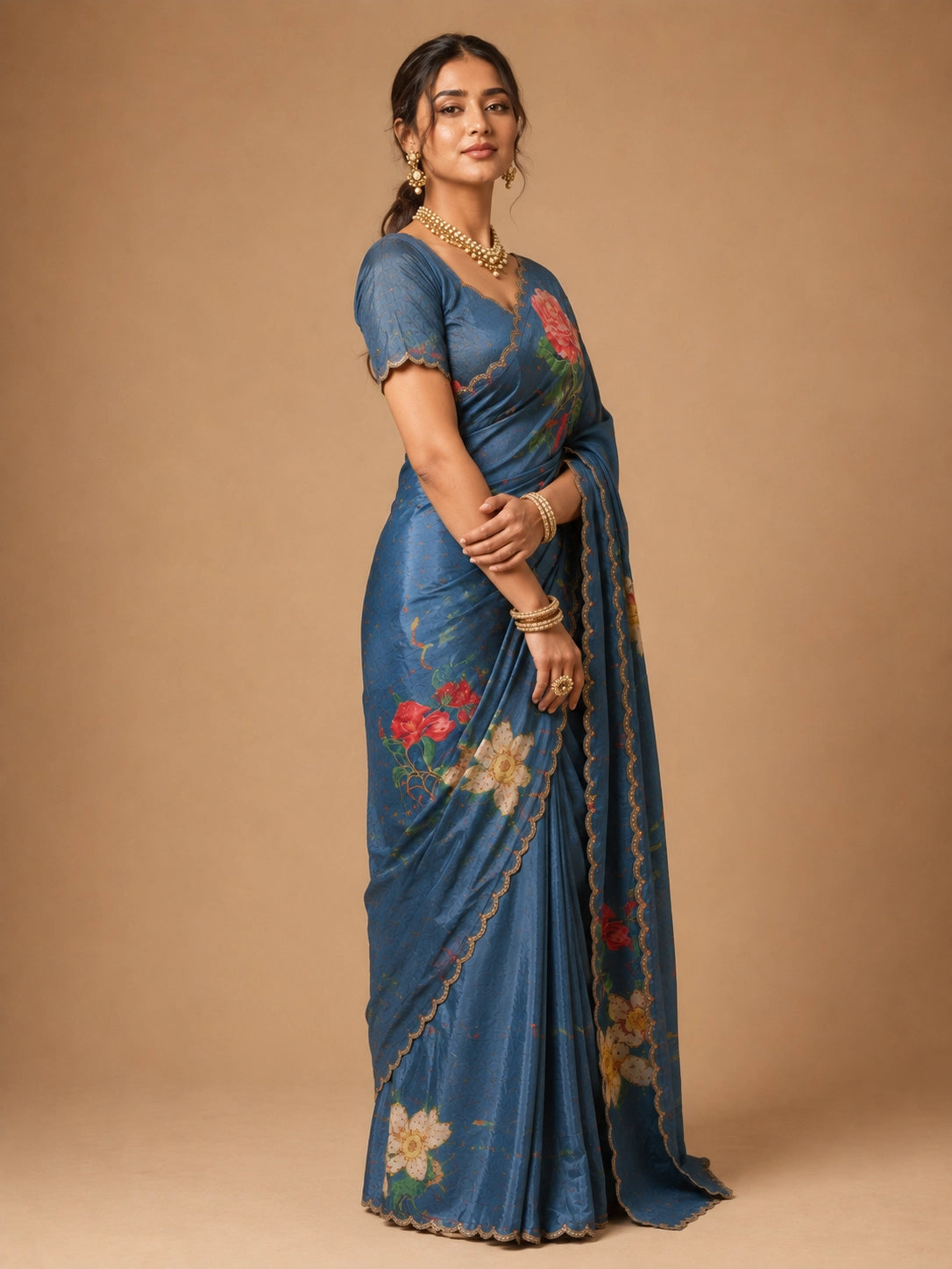 Woman wearing an elegant SKY blue  floral printed saree with a scalloped border.