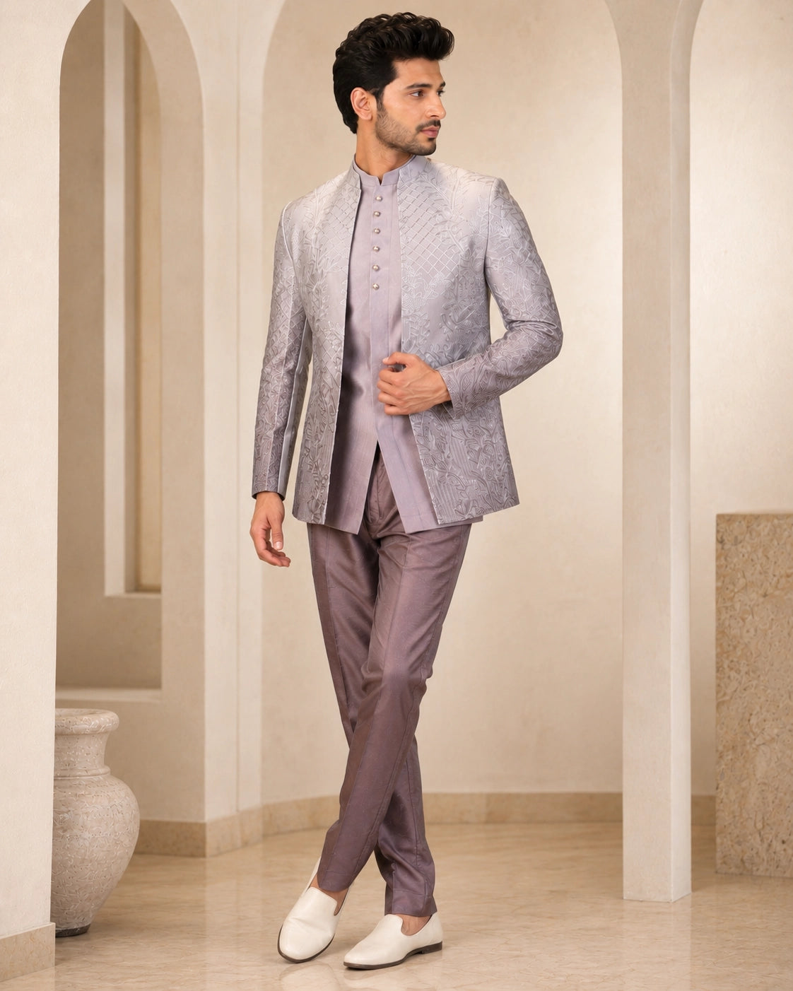 Man wearing a stylish grey Indowestern suit, perfect for formal events and celebrations.