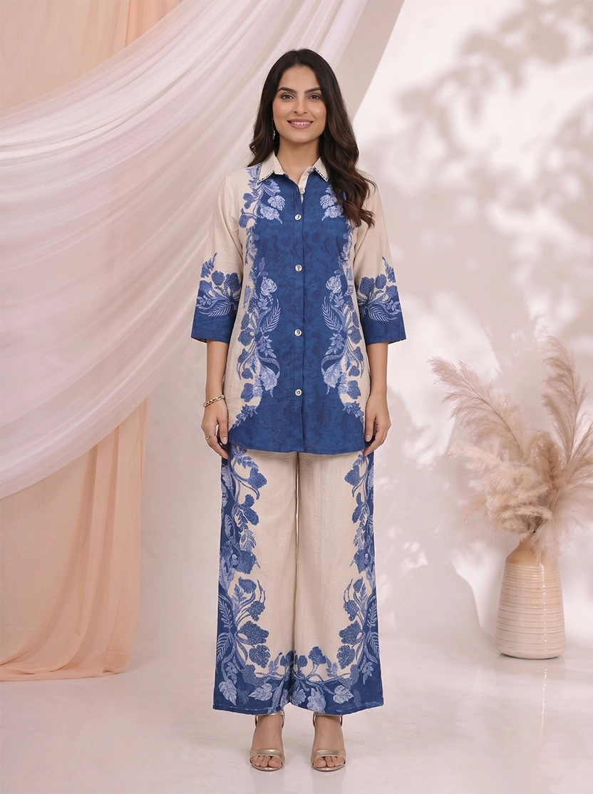 Woman wearing a blue floral print linen-blend shirt and wide-leg pants set, styled for a casual occasion.