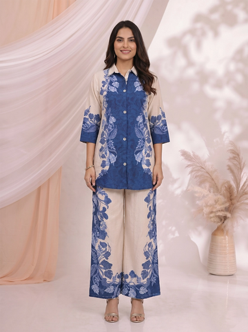 Woman wearing a blue floral print linen-blend shirt and wide-leg pants set, styled for a casual occasion.