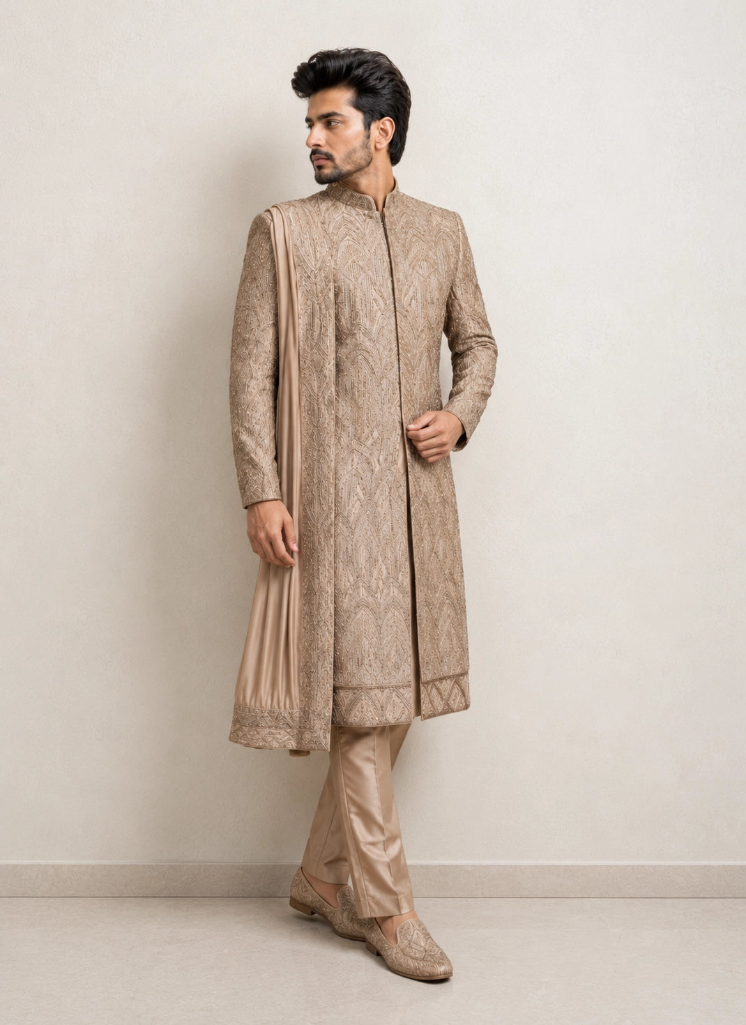 A man wearing an elegant Chikoo Sherwani, perfect for weddings and festive occasions.