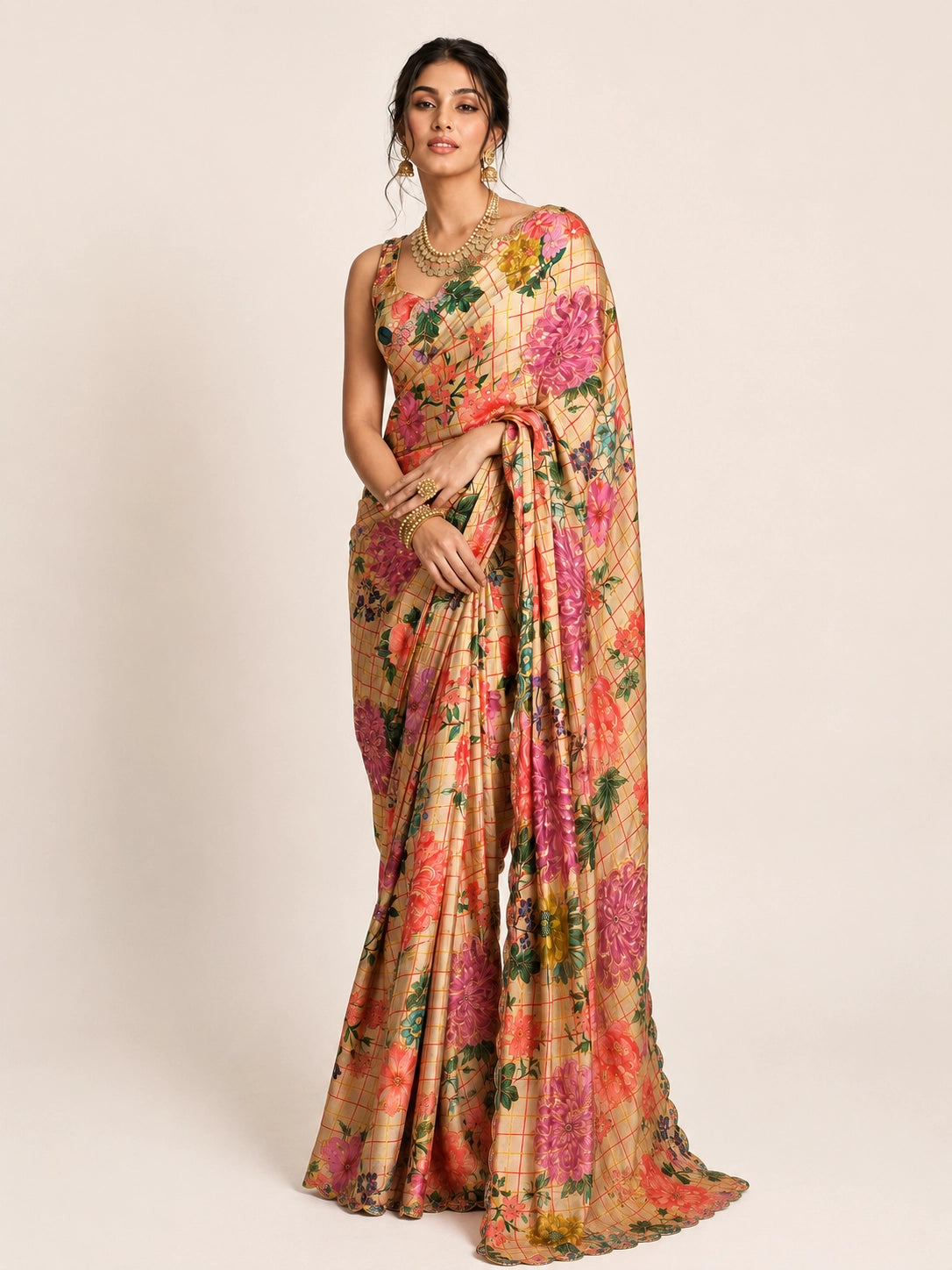 Woman elegantly draped in a cream  floral saree with vibrant multi-color prints.