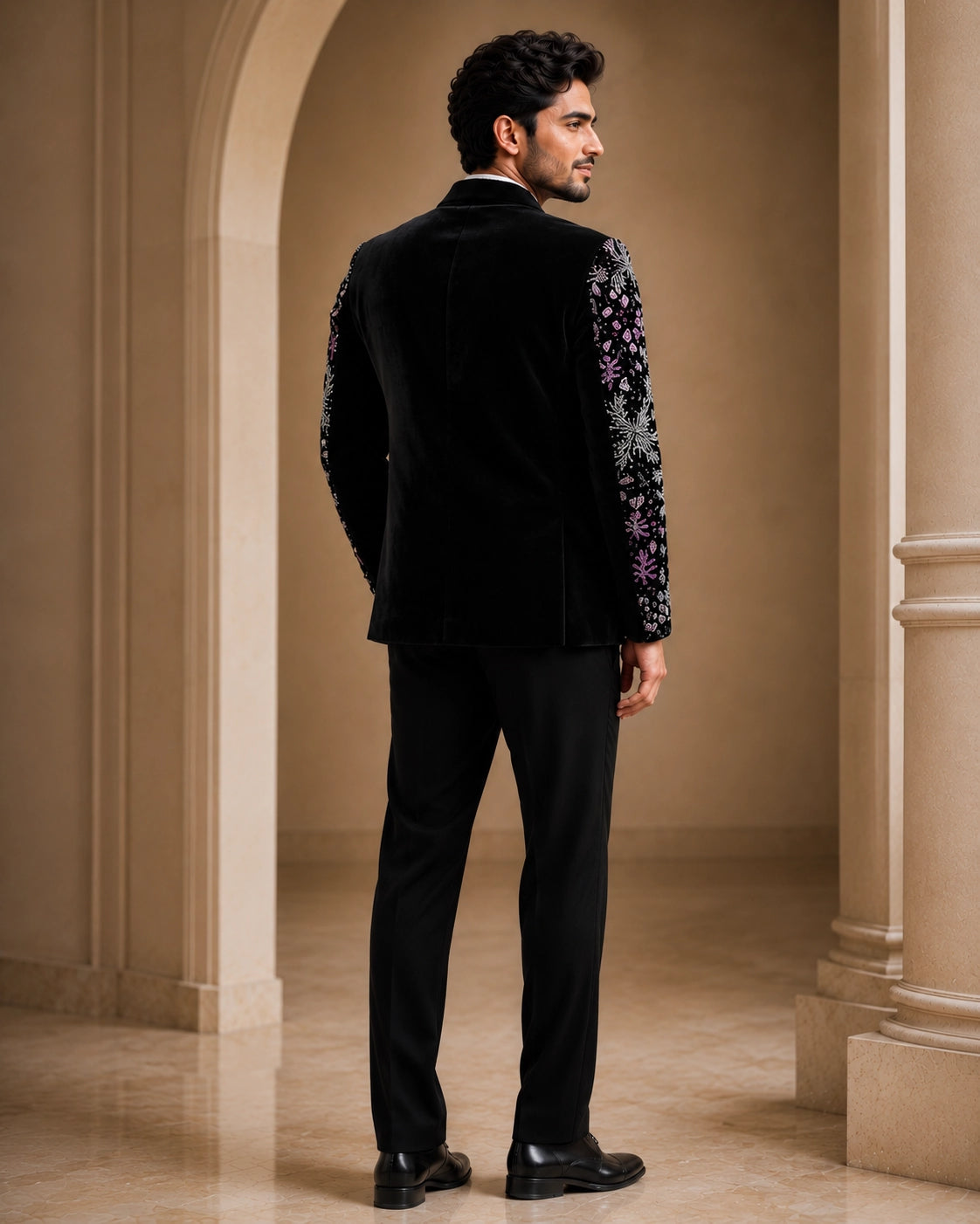A classic black taxido suit, perfect for formal events, showcasing elegant tailoring and a sophisticated look.