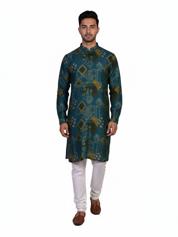 Man wearing a teal kurta with a multi-color geometric print and white pants, standing against a white background.