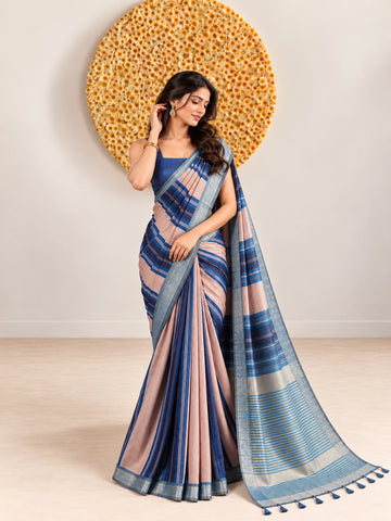 Woman in an elegant blue and pink striped saree with a detailed border.