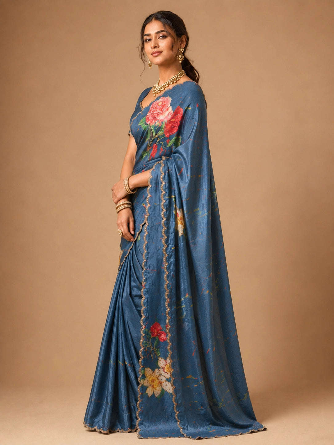 Woman wearing an elegant SKY blue  floral printed saree with a scalloped border.