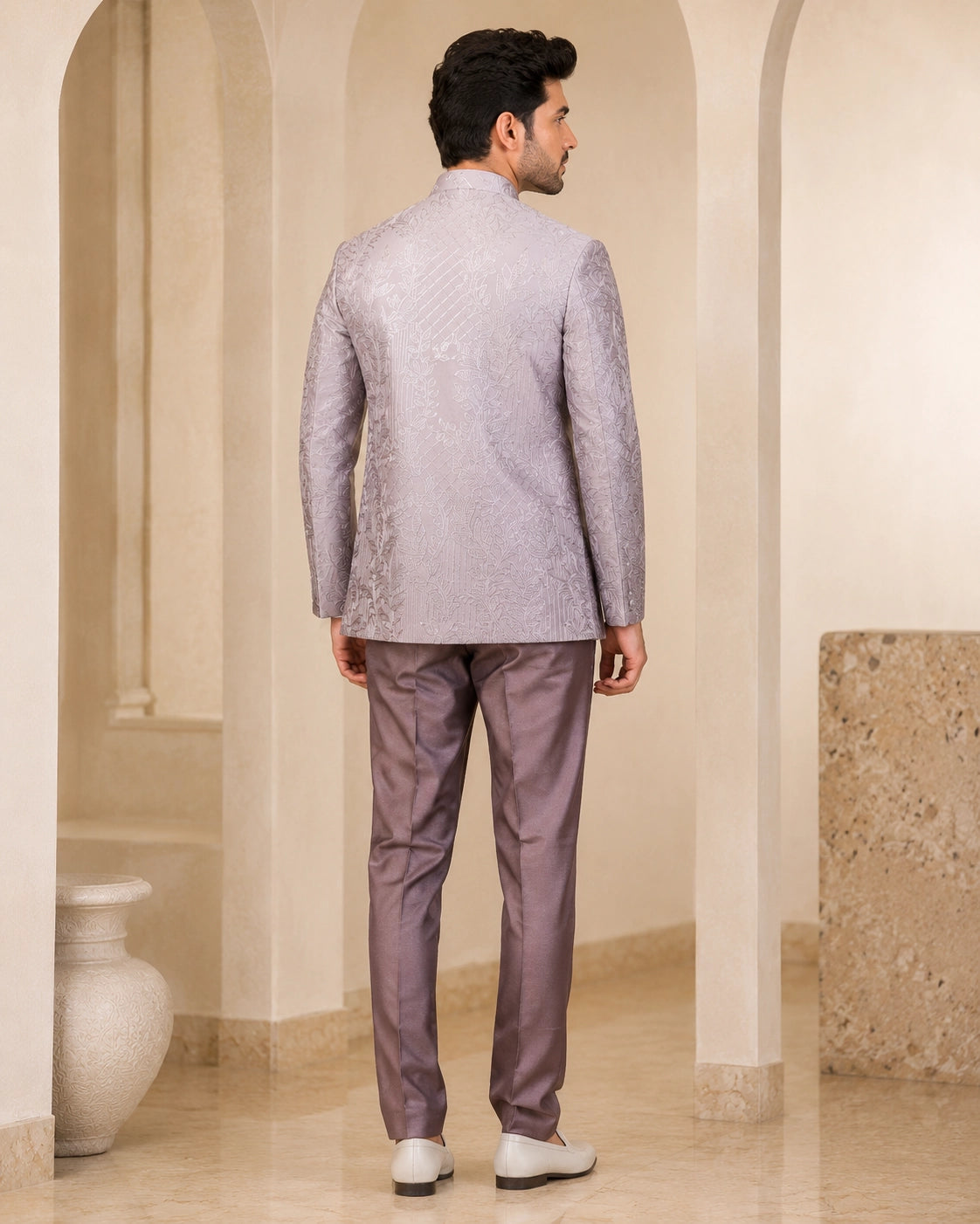 Man wearing a stylish grey Indowestern suit, perfect for formal events and celebrations.
