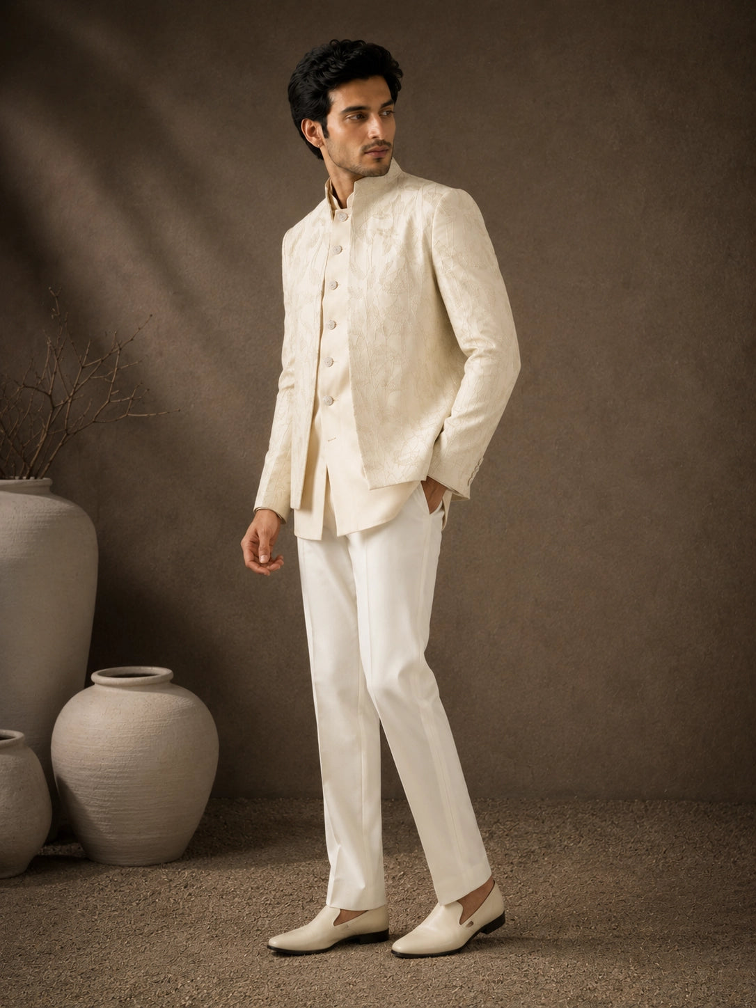 Man wearing a classic white Jodhpuri suit, perfect for formal Indian events and celebrations.