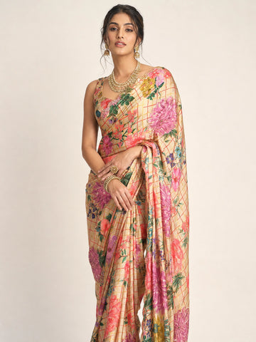Woman elegantly draped in a cream  floral saree with vibrant multi-color prints.