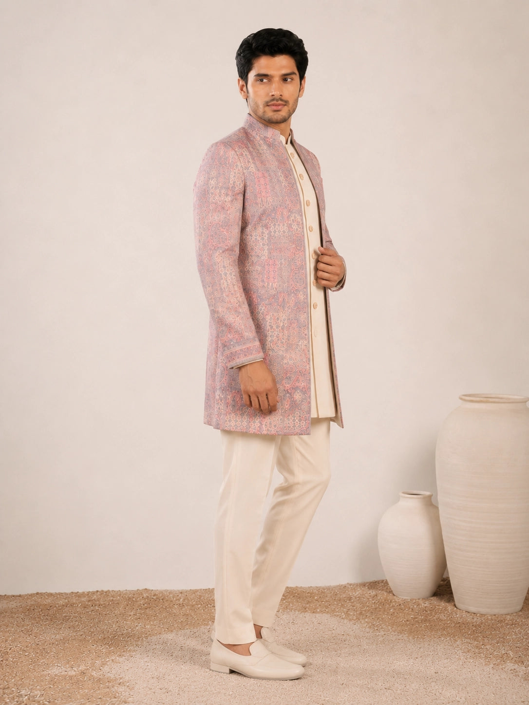 Model wearing an elegant purple Indowestern gown with delicate embroidery, front view.