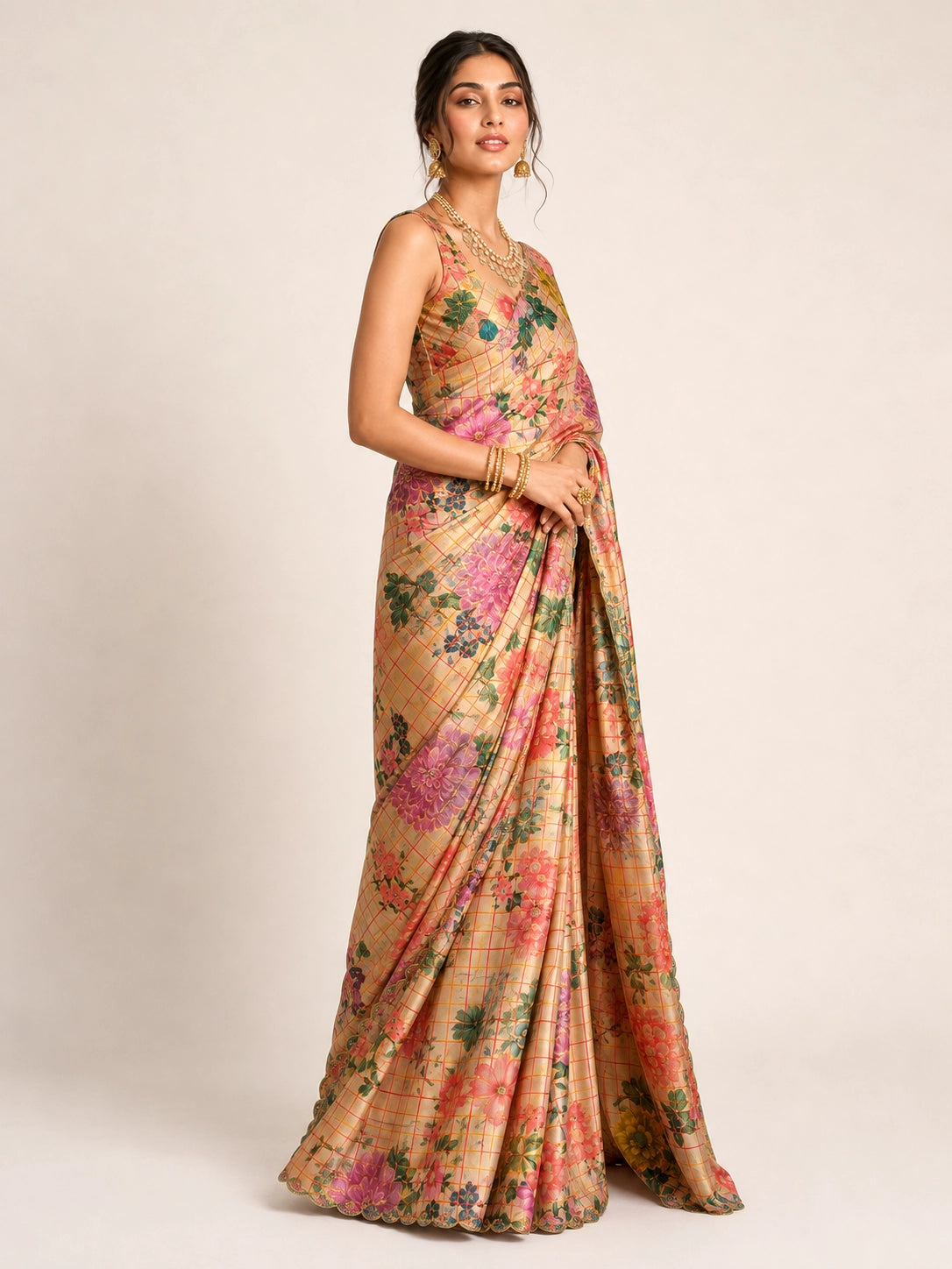 Woman elegantly draped in a cream  floral saree with vibrant multi-color prints.