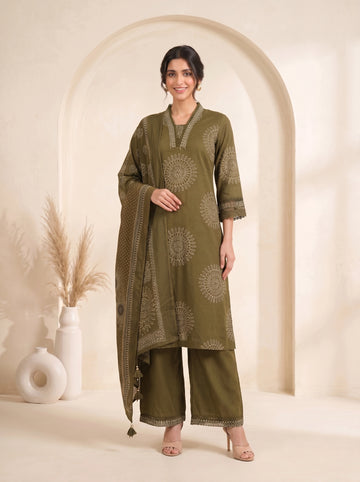 Woman wearing an olive green printed kurti with palazzo pants and a dupatta, styled for a casual or festive occasion.
