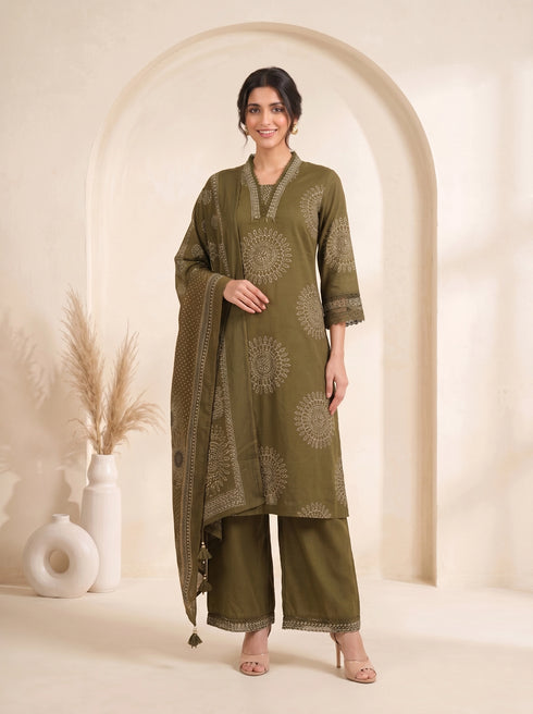 Woman wearing an olive green printed kurti with palazzo pants and a dupatta, styled for a casual or festive occasion.