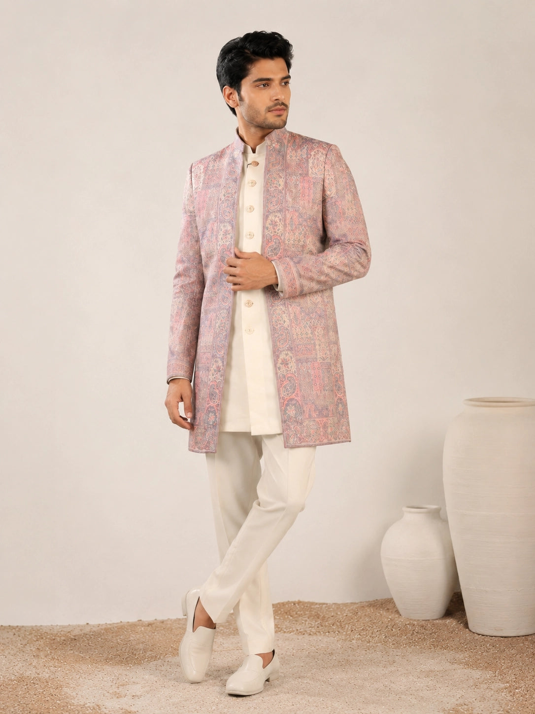 Model wearing an elegant purple Indowestern gown with delicate embroidery, front view.