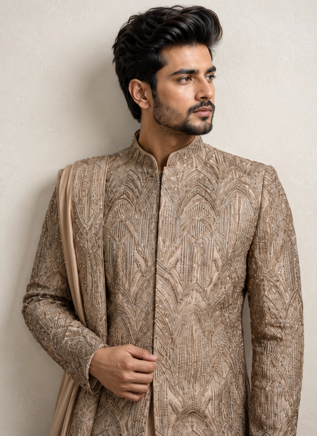 A man wearing an elegant Chikoo Sherwani, perfect for weddings and festive occasions.