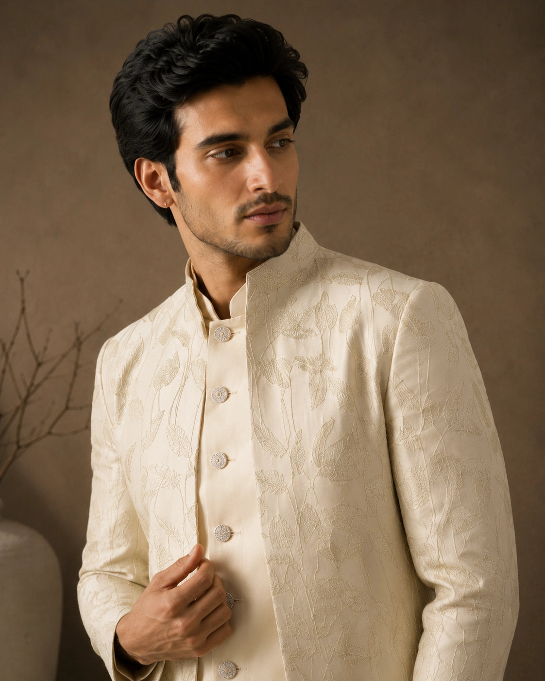 Man wearing a classic white Jodhpuri suit, perfect for formal Indian events and celebrations.