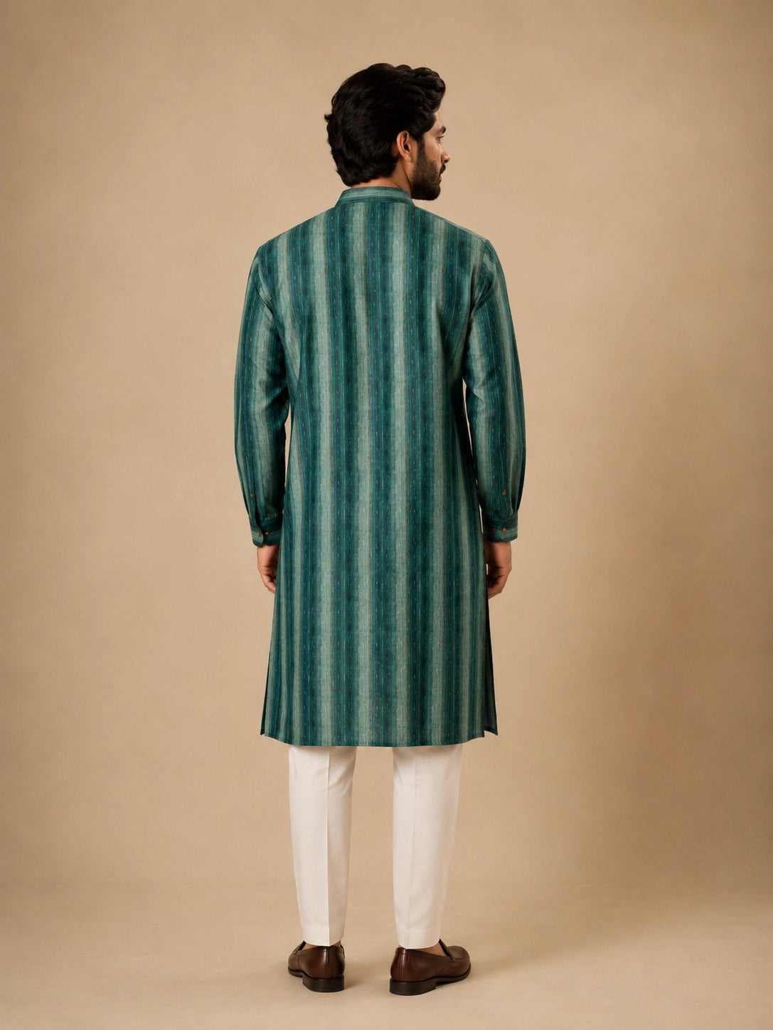 Man wearing a C.Teal striped kurta with white pajama and brown loafers.