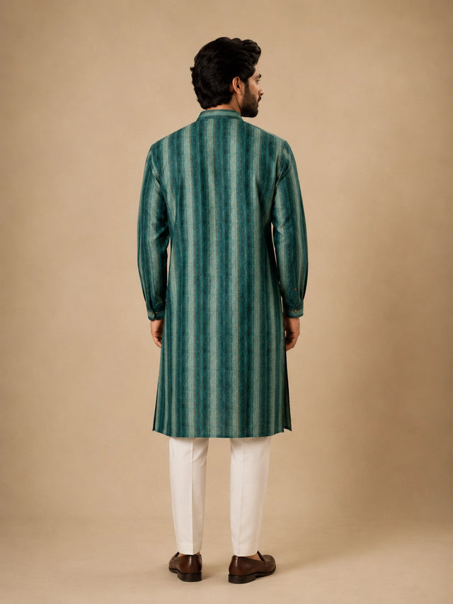 Man wearing a C.Teal striped kurta with white pajama and brown loafers.