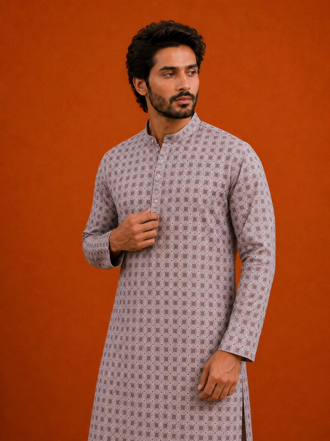 Man wearing a slaty patterned kurta with a mandarin collar, paired with cream pajama.