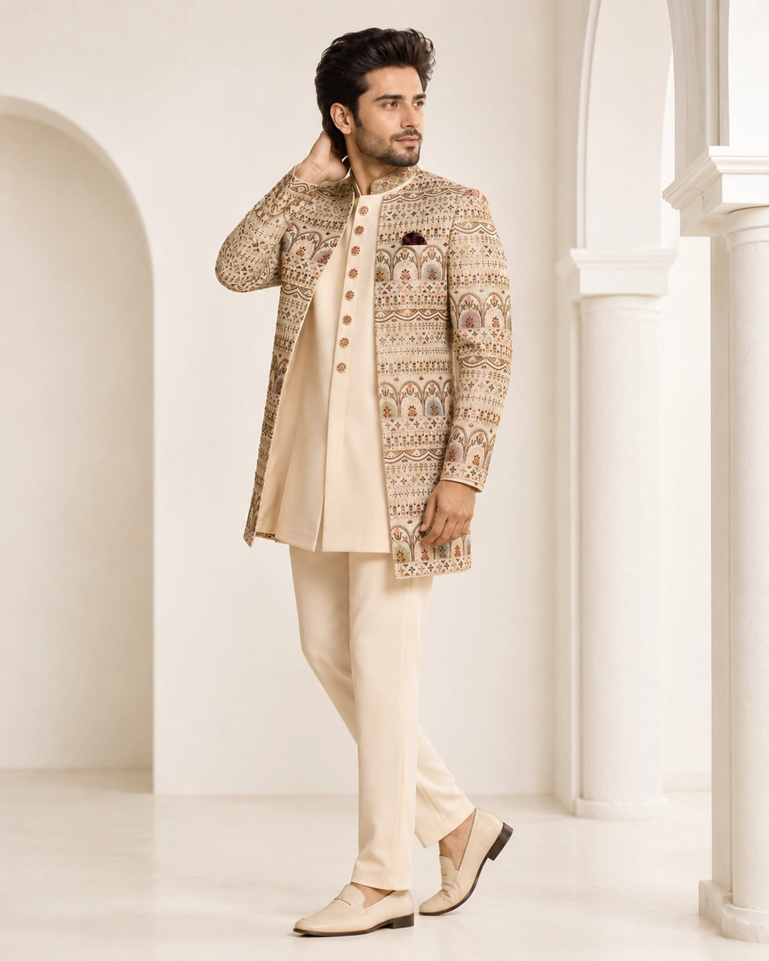Man wearing an elegant beige Sherwani, showcasing intricate embroidery and a classic fit for formal events.