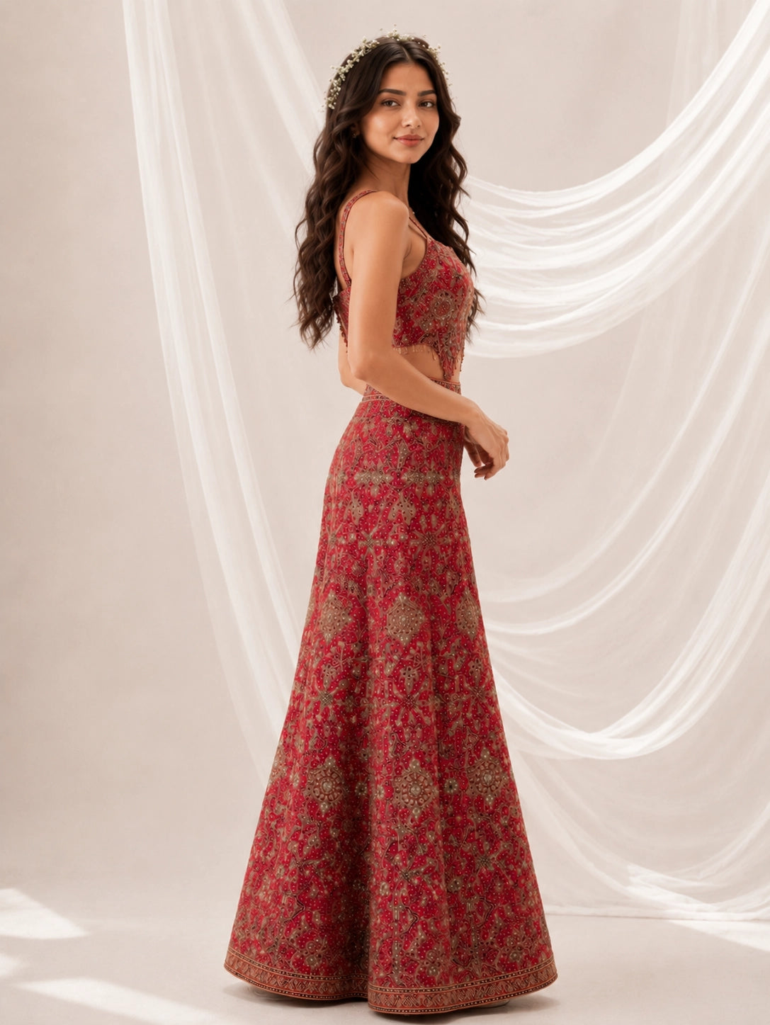 Woman in a heavily embroidered RANI strapless crop top and wide-leg palazzo pants.