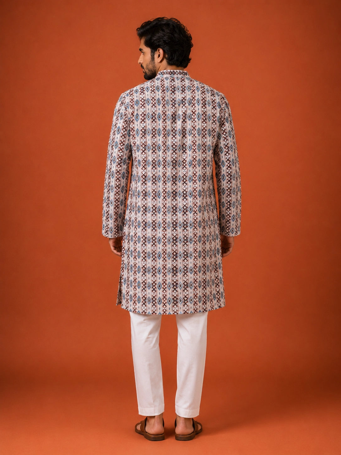 Man wearing a W.Green printed kurta with geometric pattern and white pajama.