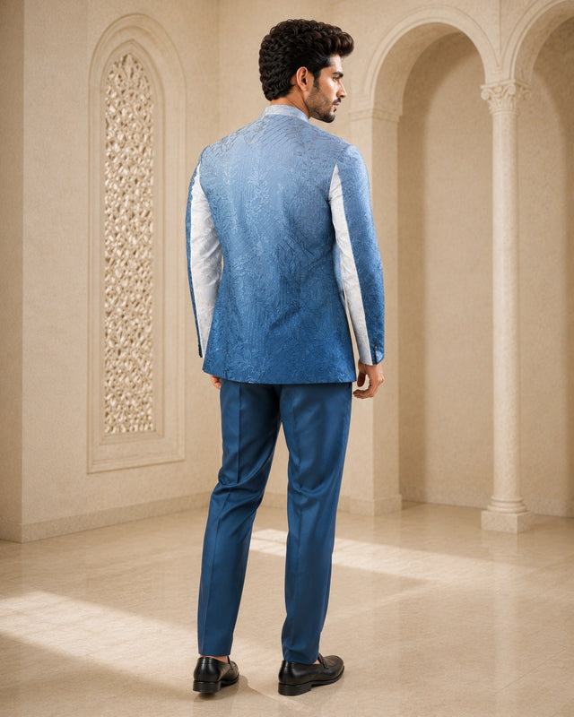 A woman wearing an elegant teal Indowestern outfit, showcasing intricate details and a flattering silhouette.