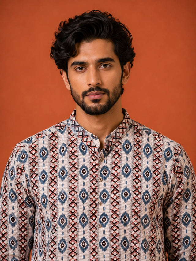 Man wearing a W.Green printed kurta with geometric pattern and white pajama.