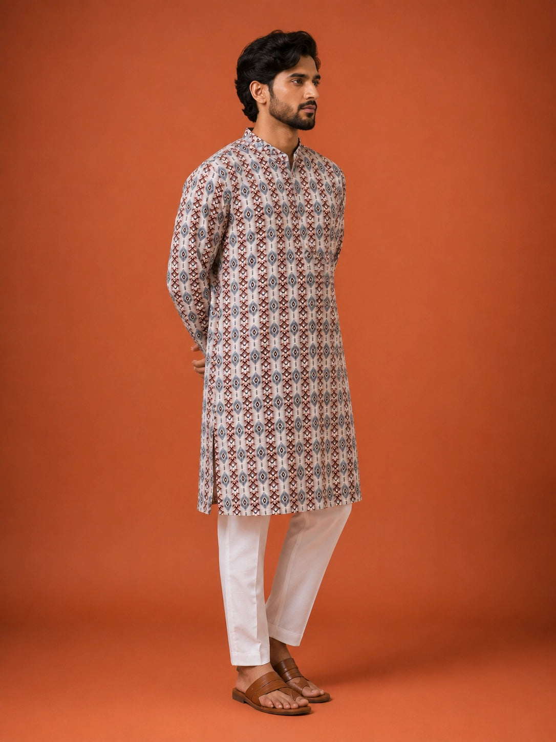 Man wearing a W.Green printed kurta with geometric pattern and white pajama.