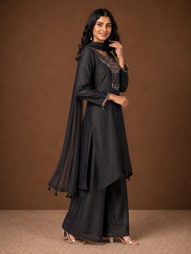 Woman wearing a Fawn sparkling embroidered Sharara with intricate floral details on the neckline and cuffs.