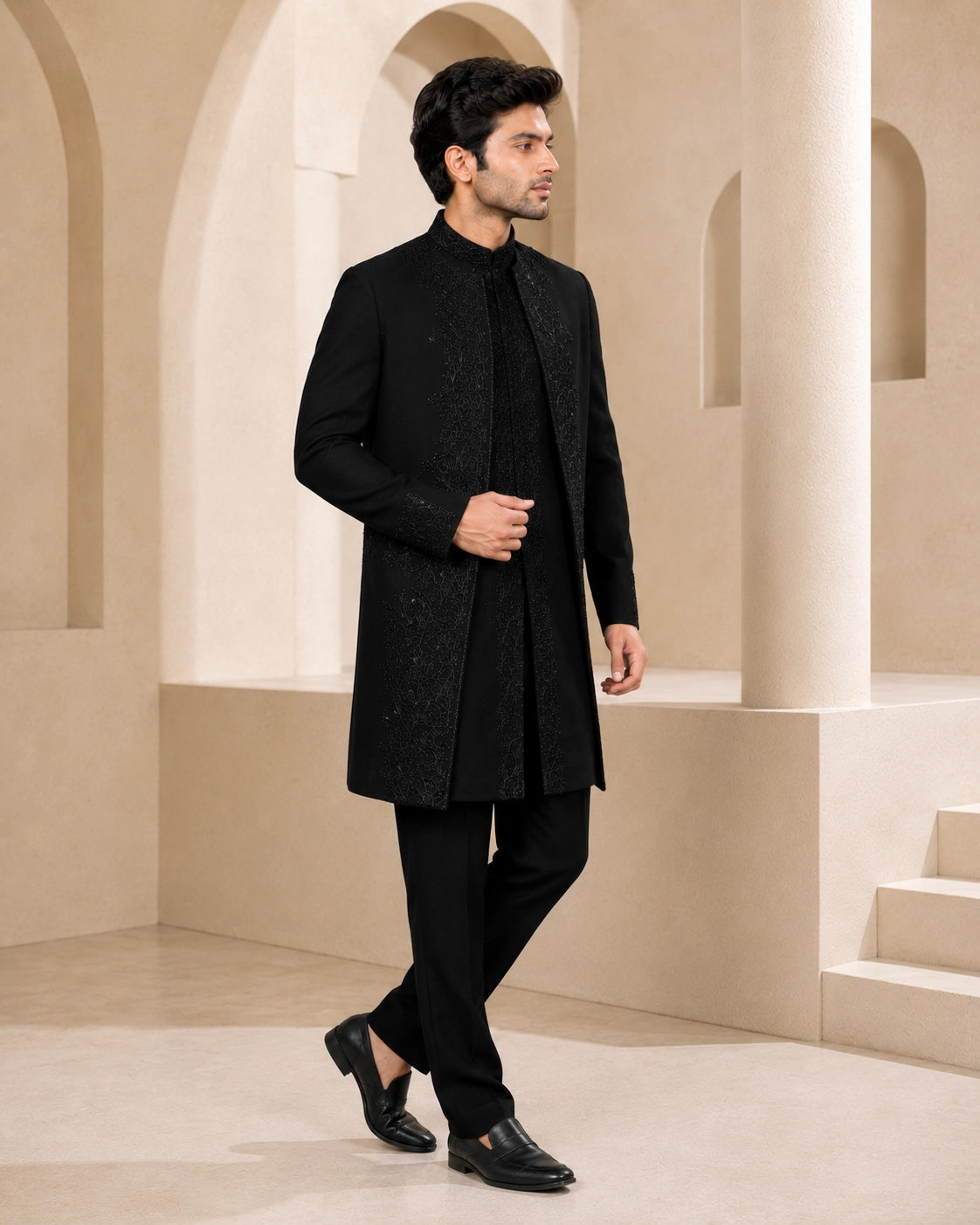Man wearing a stylish black Indo-Western suit, perfect for formal events and celebrations.