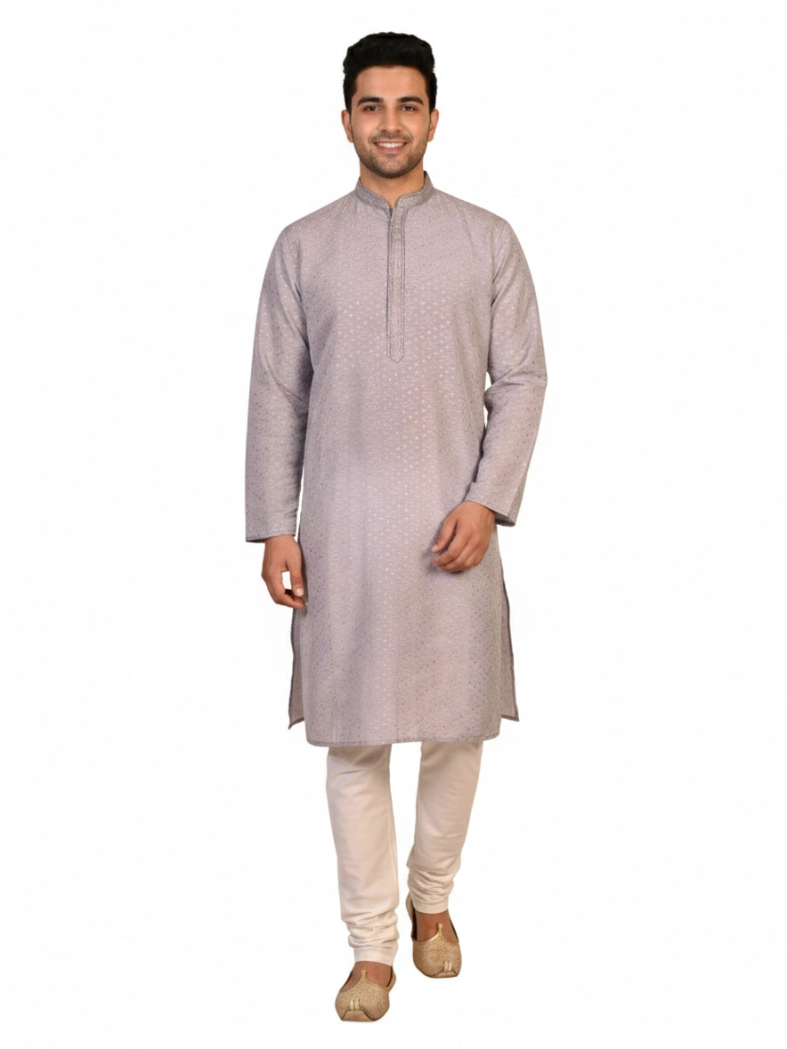 Man wearing a grey Kurta Pajama with a subtle geometric pattern and cream churidar pants.