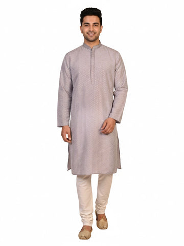 Man wearing a grey Kurta Pajama with a subtle geometric pattern and cream churidar pants.