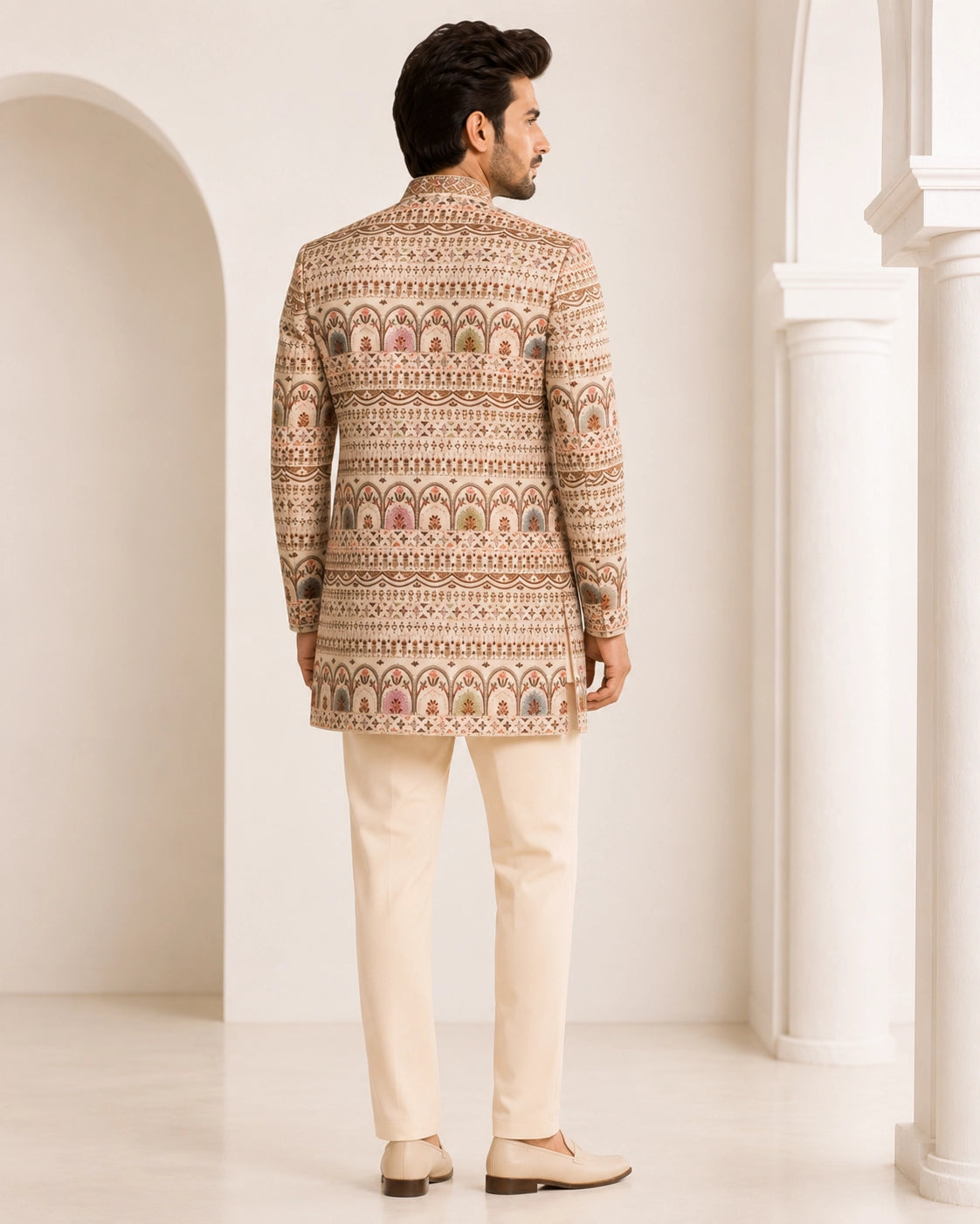 Man wearing an elegant beige Sherwani, showcasing intricate embroidery and a classic fit for formal events.