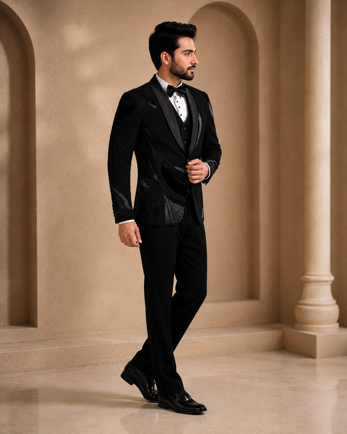 A classic black taxido suit for men, showcasing a sharp silhouette and elegant formal wear.