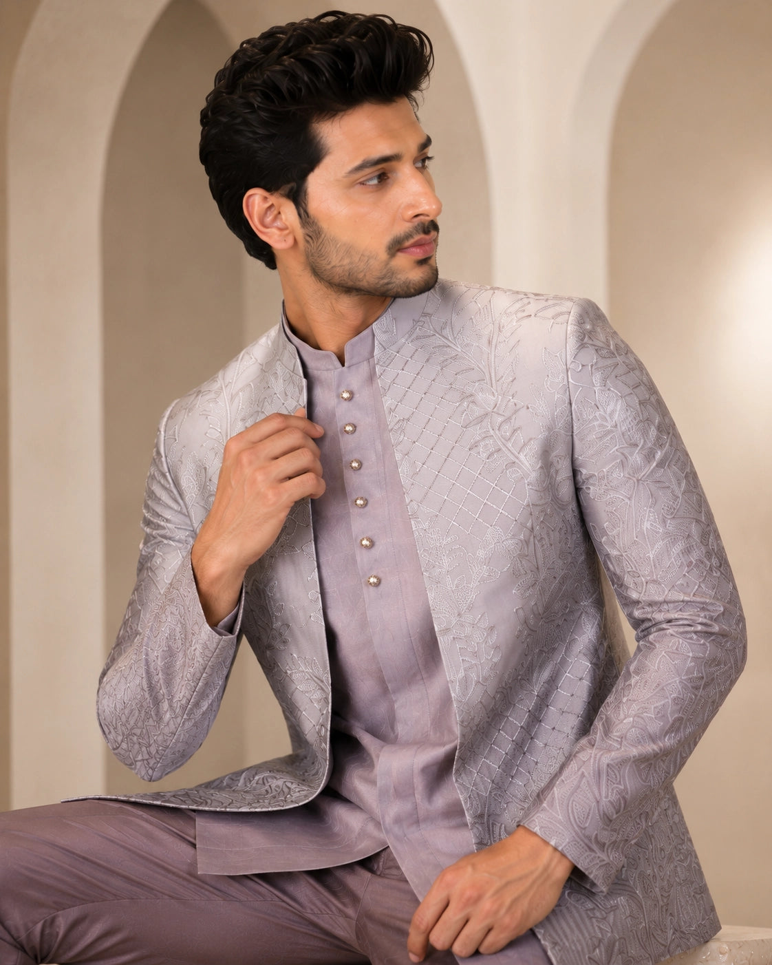 Man wearing a stylish grey Indowestern suit, perfect for formal events and celebrations.