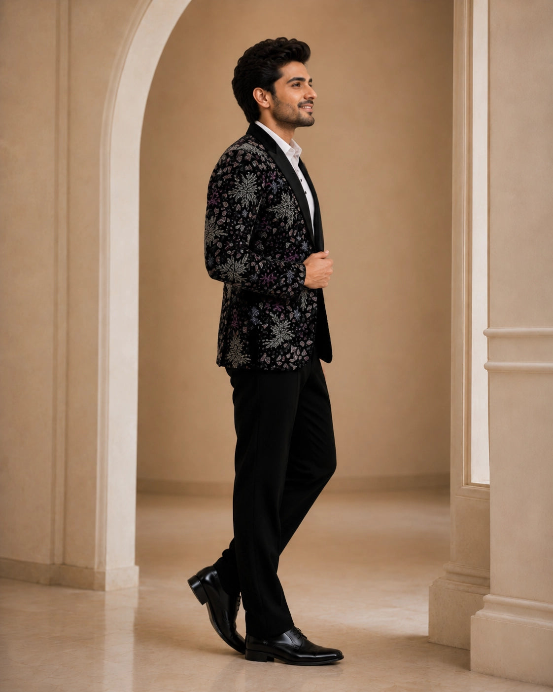 A classic black taxido suit, perfect for formal events, showcasing elegant tailoring and a sophisticated look.