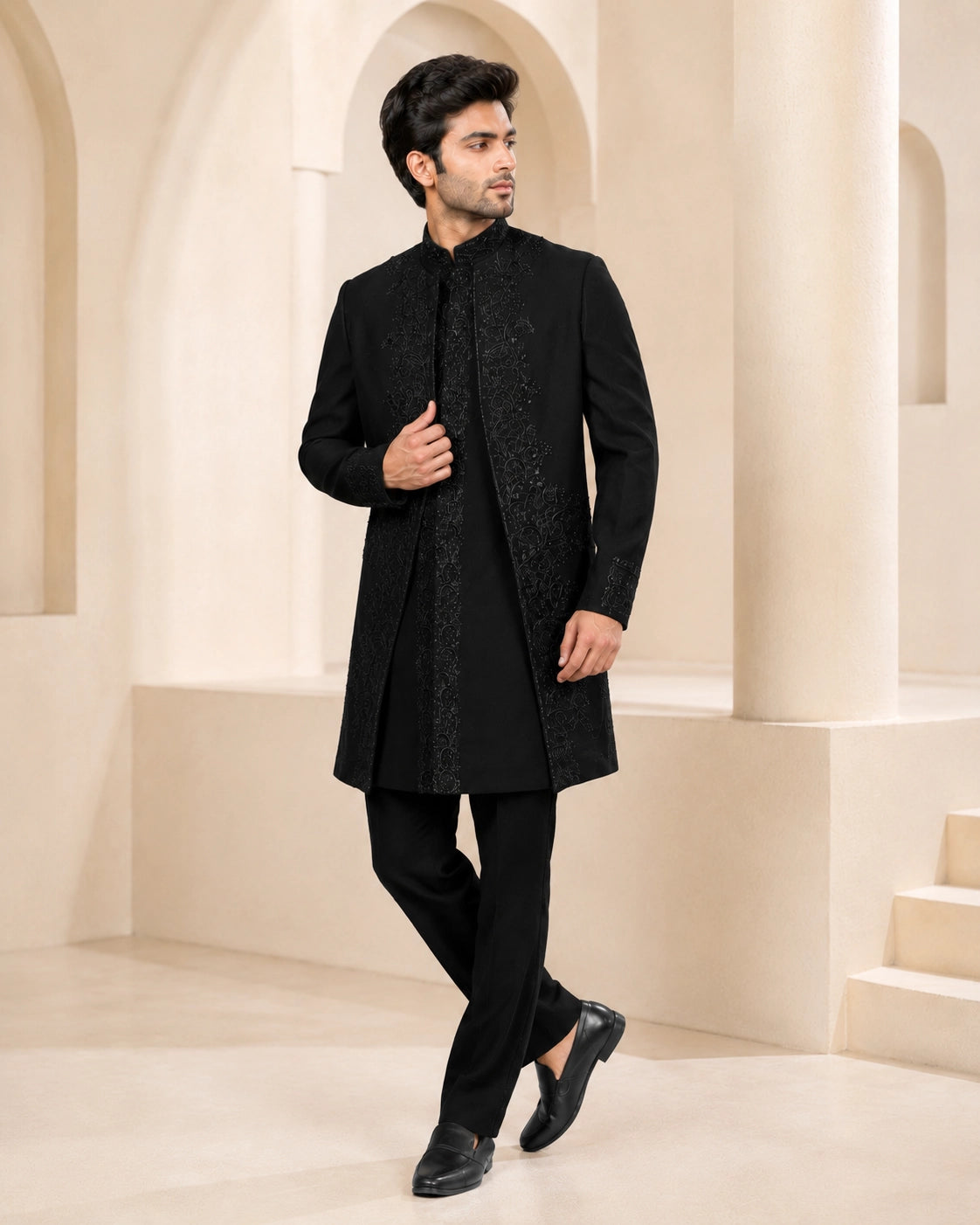 Man wearing a stylish black Indo-Western suit, perfect for formal events and celebrations.