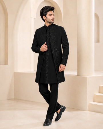 Man wearing a stylish black Indo-Western suit, perfect for formal events and celebrations.