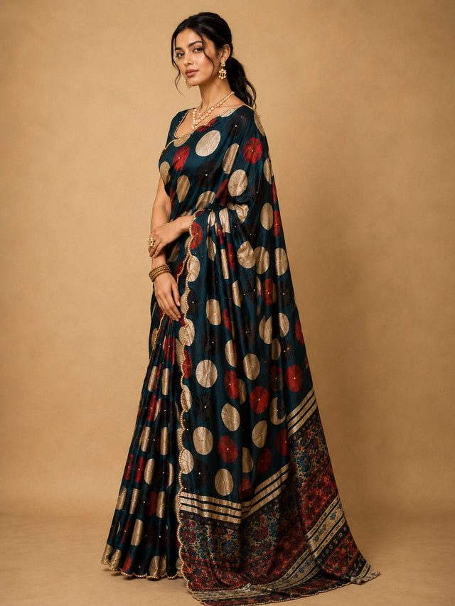 Elegant grey  saree with gold and red polka dots and scalloped border.