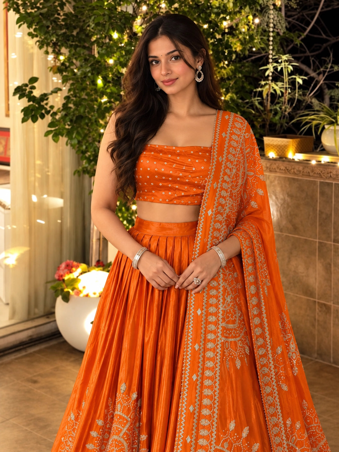 Woman in elegant rust embroidered lehenga choli set with matching dupatta.
