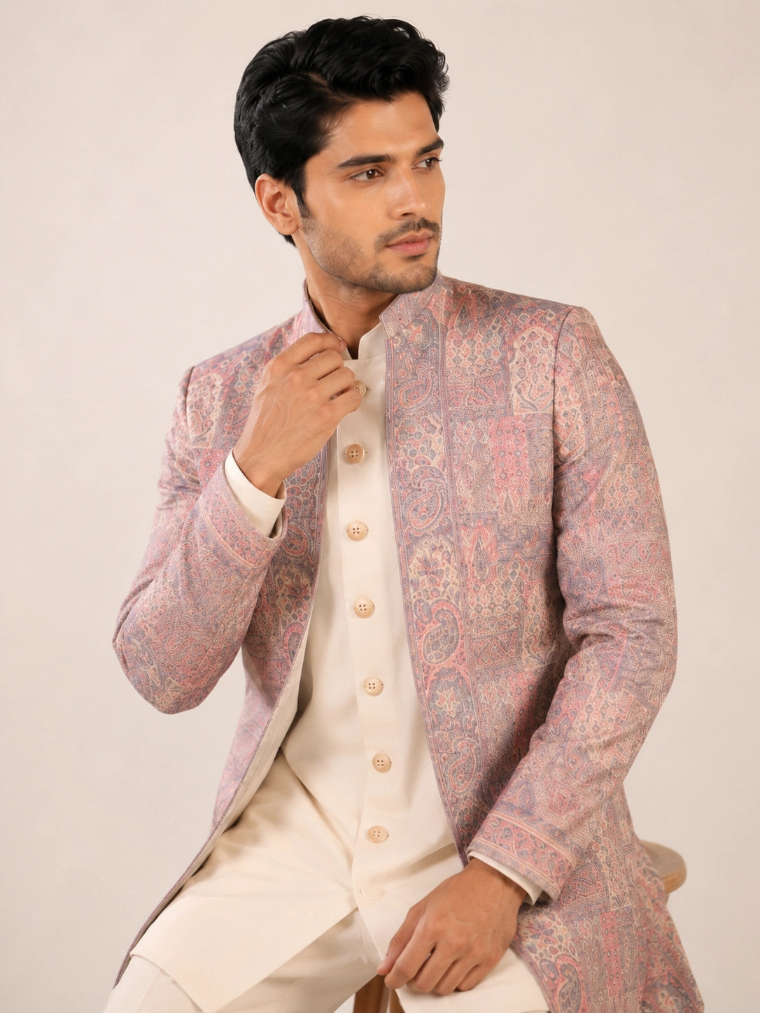 Model wearing an elegant purple Indowestern gown with delicate embroidery, front view.