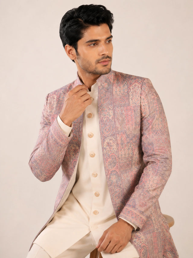 Model wearing an elegant purple Indowestern gown with delicate embroidery, front view.