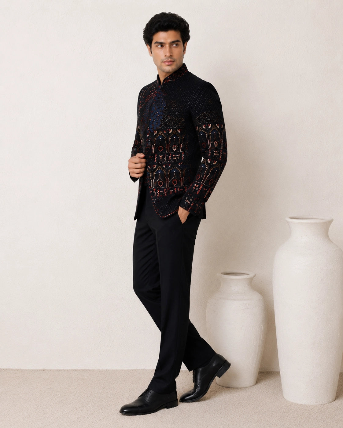 Man wearing an elegant navy blue Jodhpuri suit, a traditional Indian formal outfit.