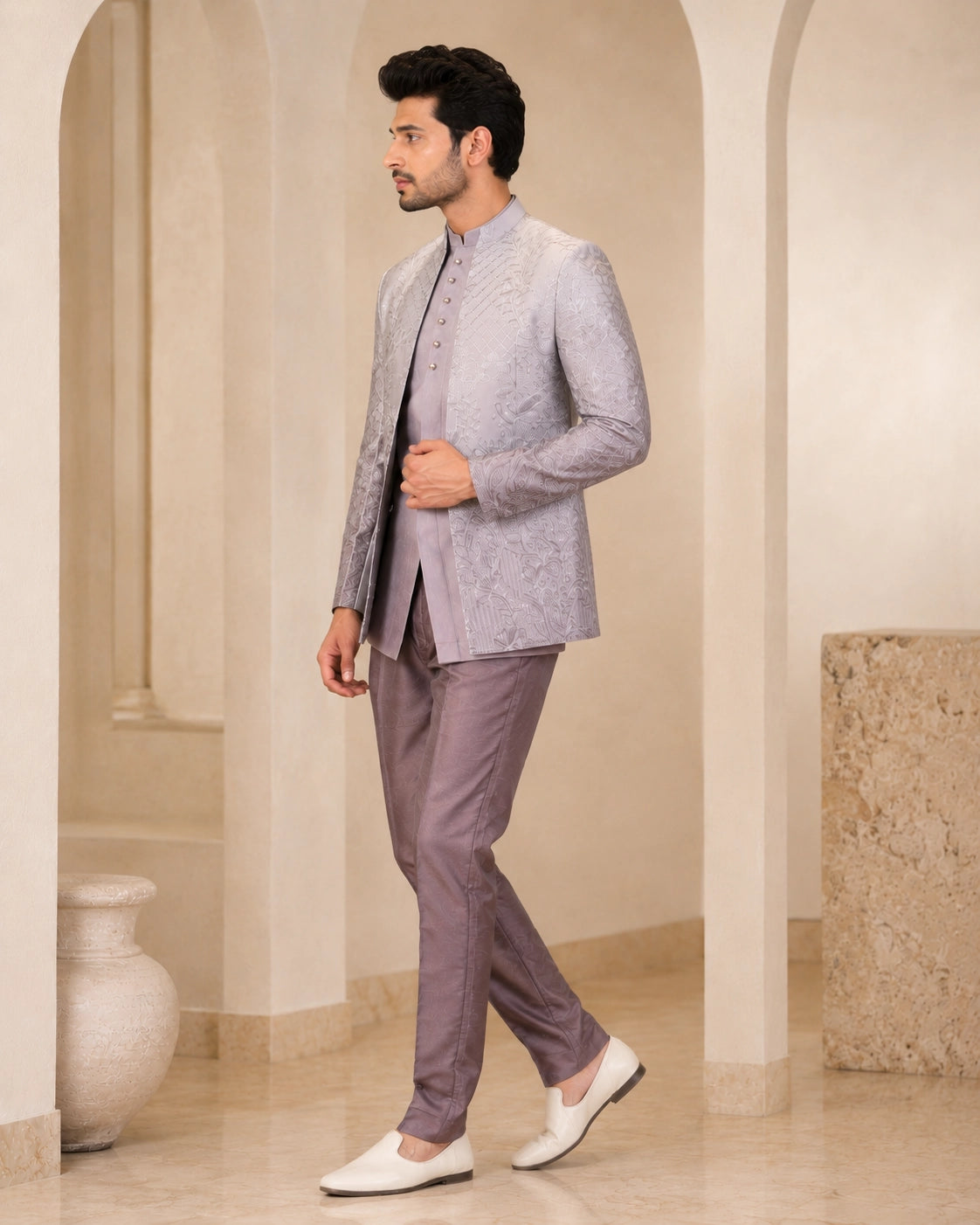 Man wearing a stylish grey Indowestern suit, perfect for formal events and celebrations.